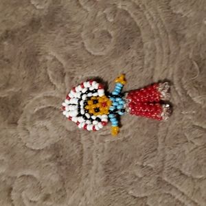 Beaded native American figure